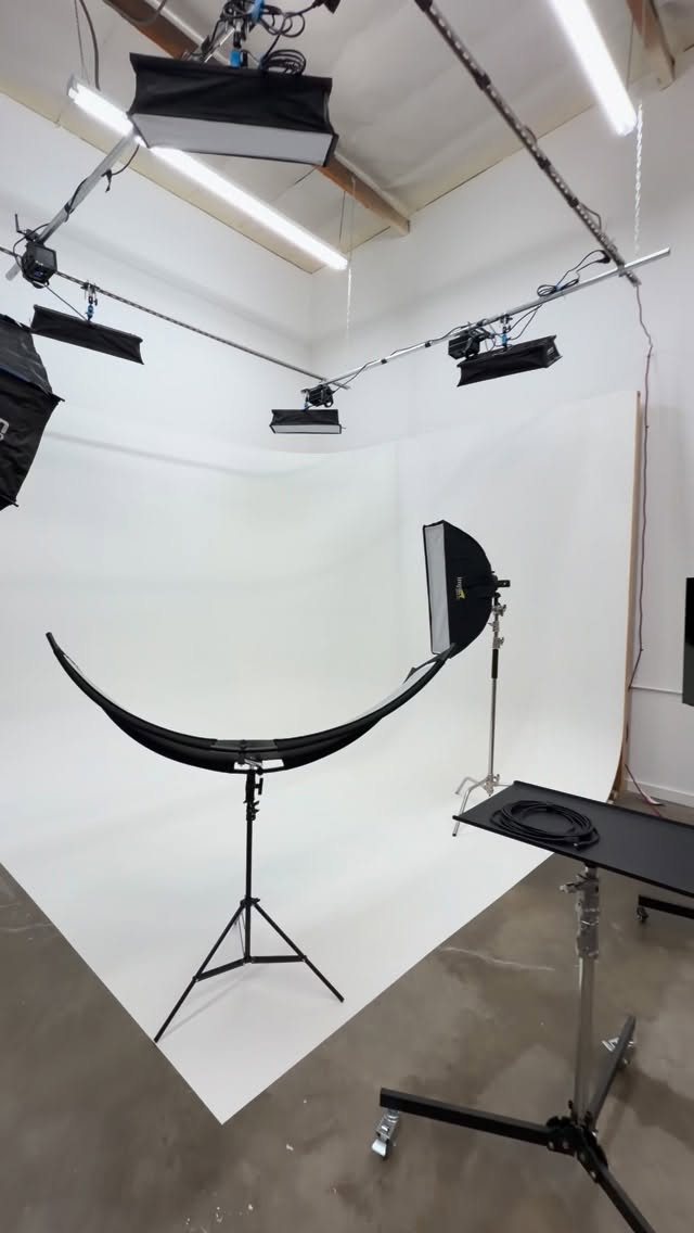 Seamless white cyclorama wall with professional lighting grid